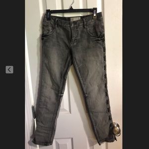 punk-styled jeans with eyelets on sides